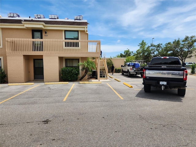 6356 7th Ave W Unit 6356, Bradenton, FL 34209 - uncovered parking lot with stairway