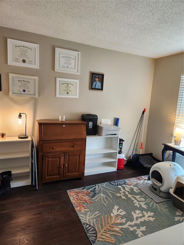 6356 7th Ave W Unit 6356, Bradenton, FL 34209 - living area featuring dark wood-style flooring and a textured ceiling