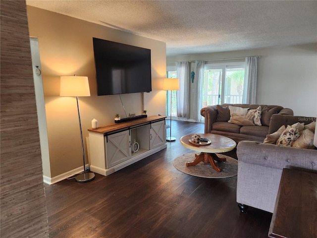 6356 7th Ave W Unit 6356, Bradenton, FL 34209 - living area with dark wood-style floors and a textured ceiling