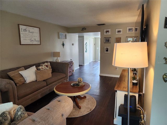 6356 7th Ave W Unit 6356, Bradenton, FL 34209 - living area with dark wood-style flooring and a textured ceiling