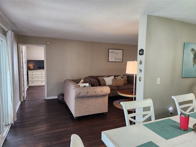 6356 7th Ave W Unit 6356, Bradenton, FL 34209 - living room featuring dark wood finished floors and a textured ceiling