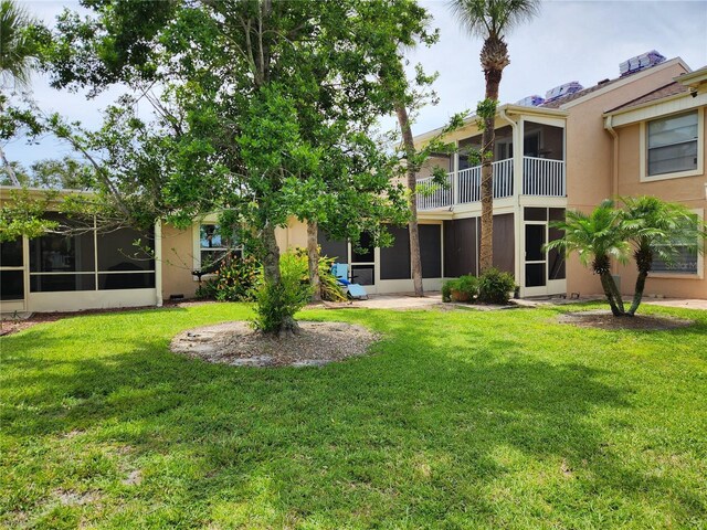 6356 7th Ave W Unit 6356, Bradenton, FL 34209 - view of grassy yard with a sunroom