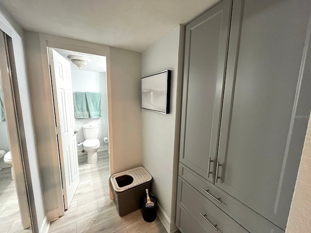 880 Mandalay Ave Unit C206, Clearwater, FL 33767 - bathroom featuring toilet and wood finished floors