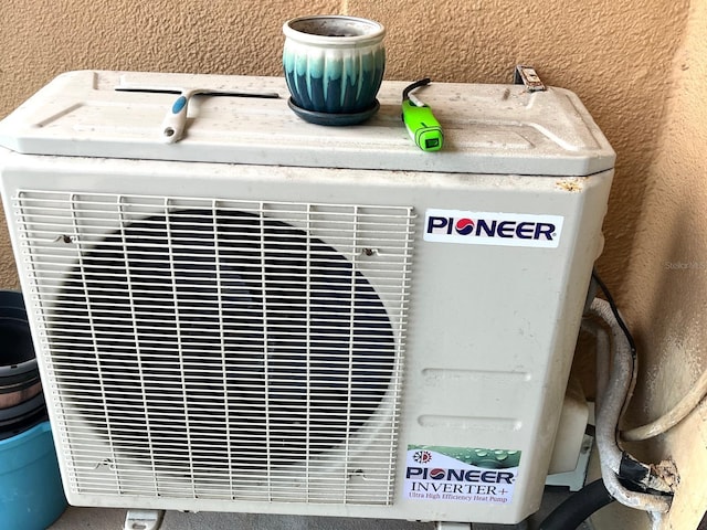 880 Mandalay Ave Unit C206, Clearwater, FL 33767 - detailed view of an ac unit and stucco siding