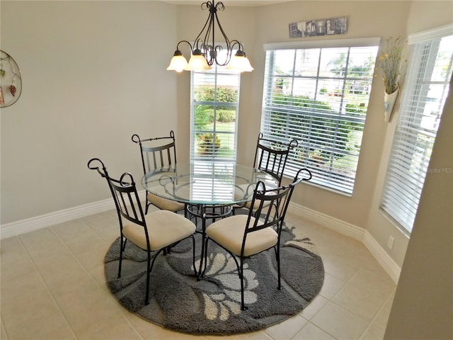 11802 Aintree Ct, Trinity, FL 34655 - dining space featuring light tile patterned floors and a chandelier