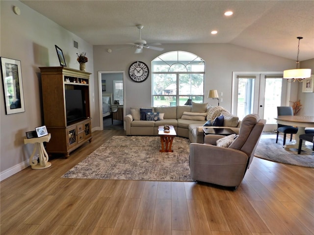 11802 Aintree Ct, Trinity, FL 34655 - living room with vaulted ceiling, ceiling fan, wood finished floors, and recessed lighting