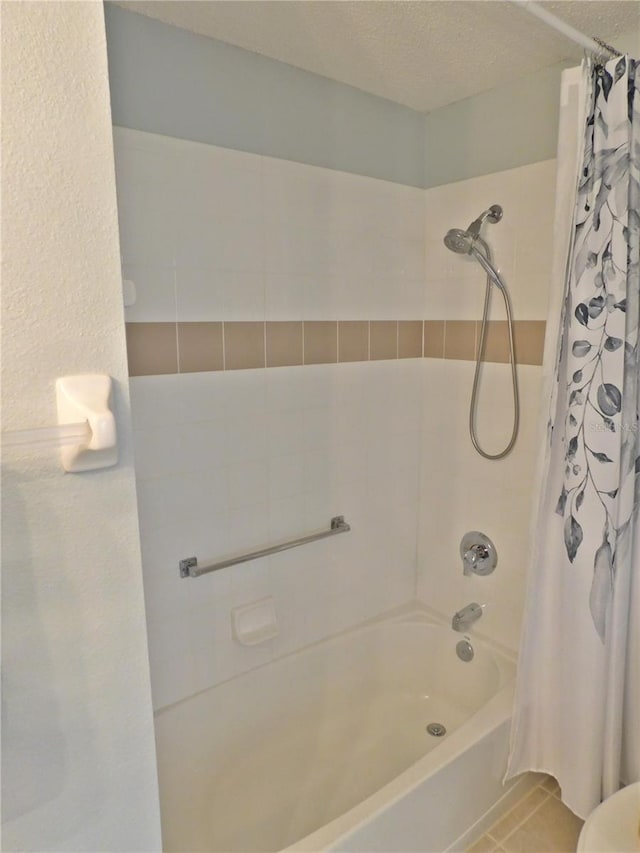 11802 Aintree Ct, Trinity, FL 34655 - bathroom featuring shower / tub combo with curtain and tile patterned floors