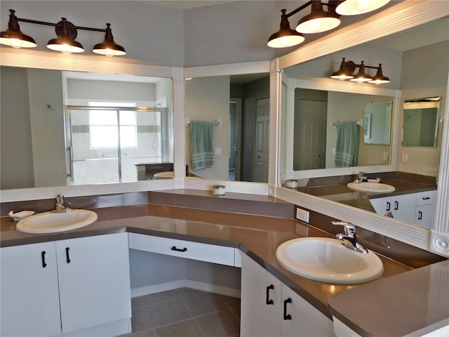 11802 Aintree Ct, Trinity, FL 34655 - bathroom featuring vanity, a shower stall, and tile patterned flooring