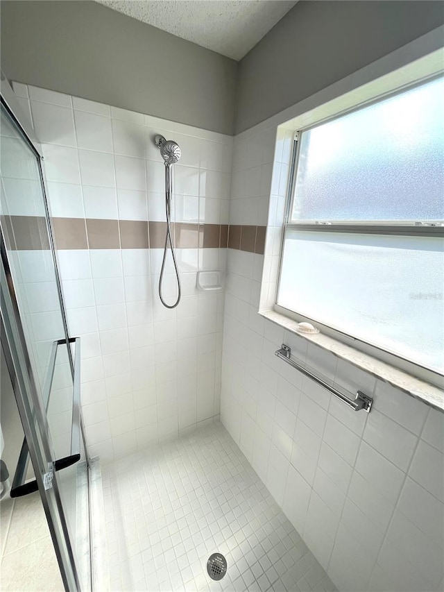 11802 Aintree Ct, Trinity, FL 34655 - full bathroom featuring a shower stall and tile patterned floors