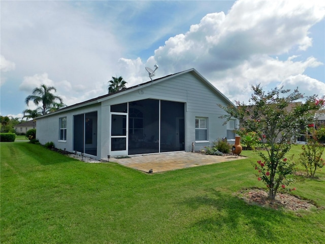 11802 Aintree Ct, Trinity, FL 34655 - back of property with a patio, a yard, a sunroom, and stucco siding