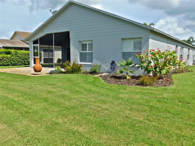 11802 Aintree Ct, Trinity, FL 34655 - back of house with a sunroom, a lawn, and a patio area