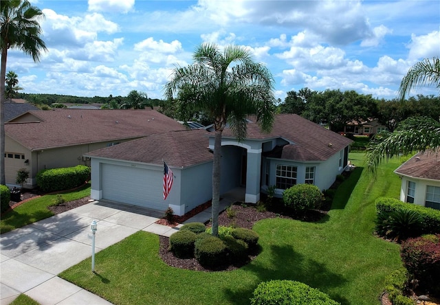 11802 Aintree Ct, Trinity, FL 34655 - view of front facade featuring stucco siding, an attached garage, driveway, and a shingled roof