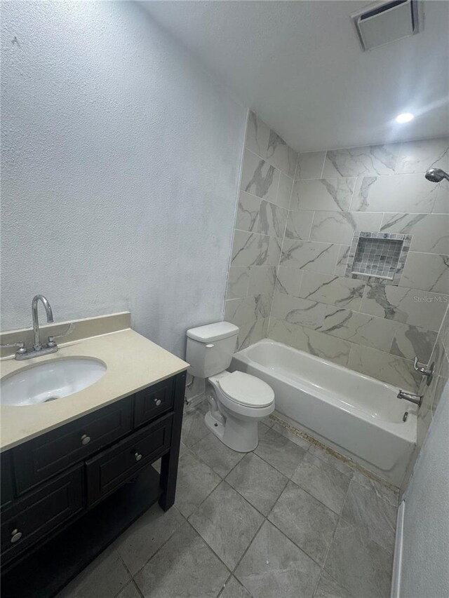 6133 Arthur Ave, New Port Richey, FL 34653 - bathroom featuring vanity, a textured wall, and shower / bathtub combination