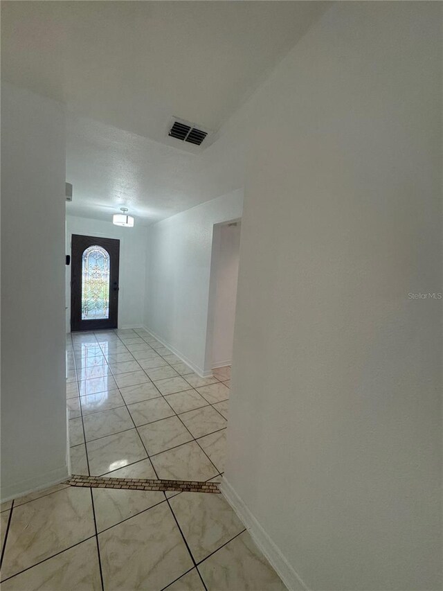 6133 Arthur Ave, New Port Richey, FL 34653 - hall with baseboards and light marble finish flooring