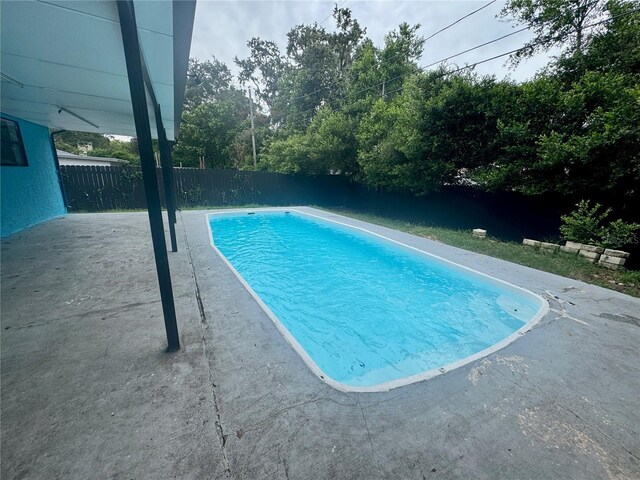 6133 Arthur Ave, New Port Richey, FL 34653 - view of swimming pool featuring a patio and a fenced backyard