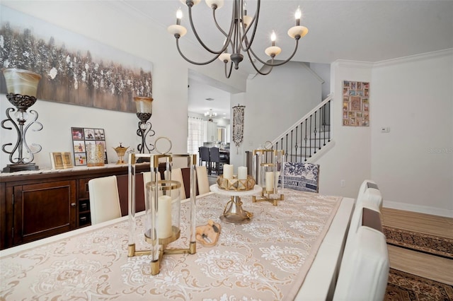 11132 Running Pine Dr, Riverview, FL 33569 - dining room with a chandelier, crown molding, and stairs