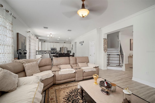 11132 Running Pine Dr, Riverview, FL 33569 - living area featuring crown molding, ceiling fan, light wood-style flooring, a chandelier, and recessed lighting