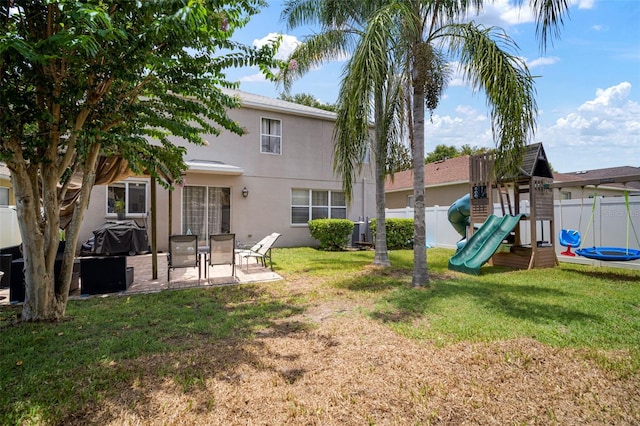 11132 Running Pine Dr, Riverview, FL 33569 - fenced backyard featuring a playground and a patio