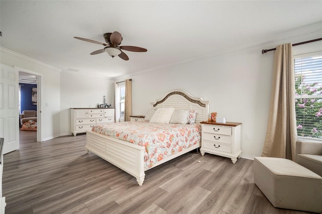 11132 Running Pine Dr, Riverview, FL 33569 - bedroom featuring wood finished floors, crown molding, and ceiling fan