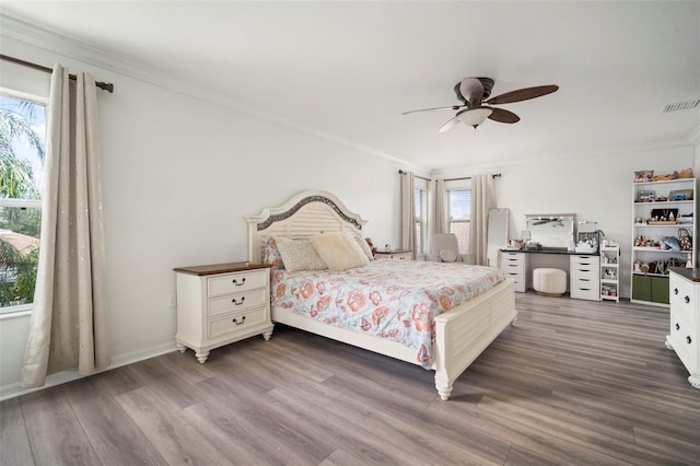 11132 Running Pine Dr, Riverview, FL 33569 - bedroom featuring ornamental molding, wood finished floors, and a ceiling fan