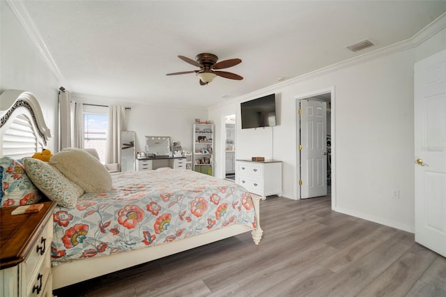 11132 Running Pine Dr, Riverview, FL 33569 - bedroom with ornamental molding, wood finished floors, and ceiling fan