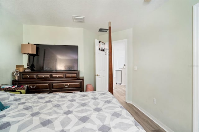 11132 Running Pine Dr, Riverview, FL 33569 - bedroom featuring wood finished floors and baseboards