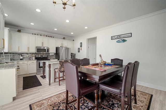 11132 Running Pine Dr, Riverview, FL 33569 - dining area with ornamental molding, recessed lighting, a chandelier, and light wood-type flooring