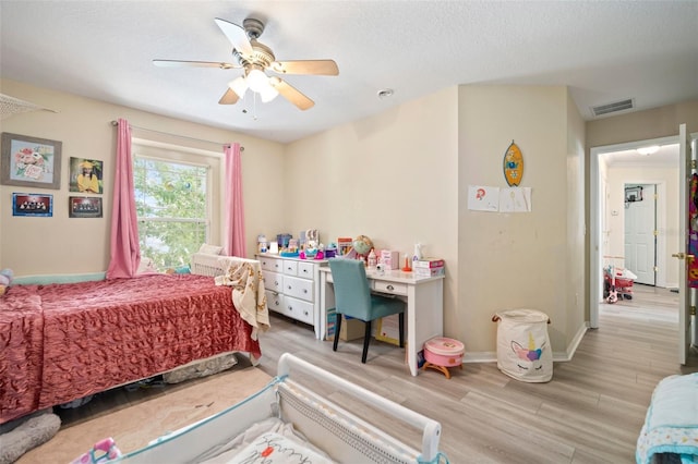 11132 Running Pine Dr, Riverview, FL 33569 - bedroom featuring wood finished floors and ceiling fan