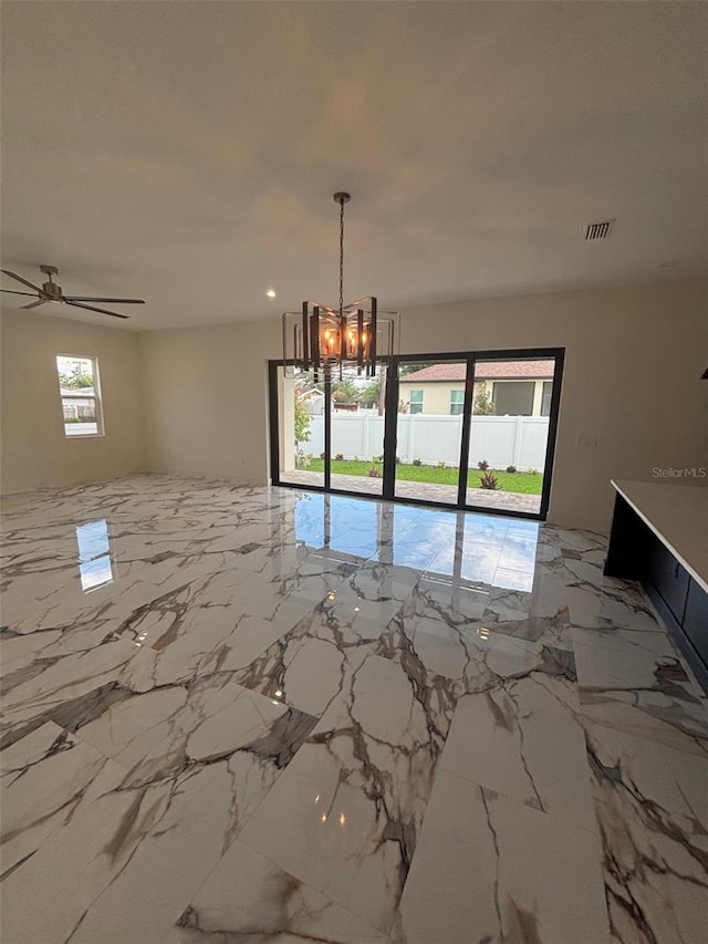 2516 W Abdella St, Tampa, FL 33607 - unfurnished dining area with a chandelier, ceiling fan, and marble tiled floors