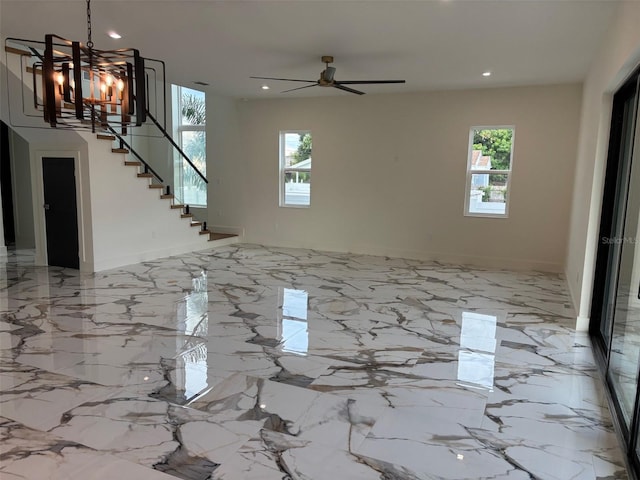 2516 W Abdella St, Tampa, FL 33607 - unfurnished living room with healthy amount of natural light, recessed lighting, stairway, a chandelier, and a ceiling fan