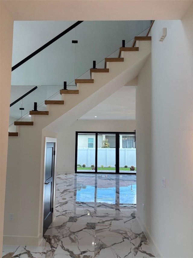 2516 W Abdella St, Tampa, FL 33607 - stairway featuring marble tiled flooring and a towering ceiling