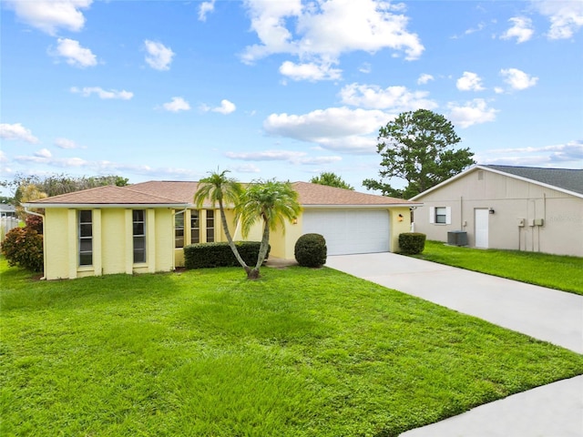 4371 Otter Way, New Port Richey, FL 34653 - ranch-style house with concrete driveway, a front lawn, and a garage