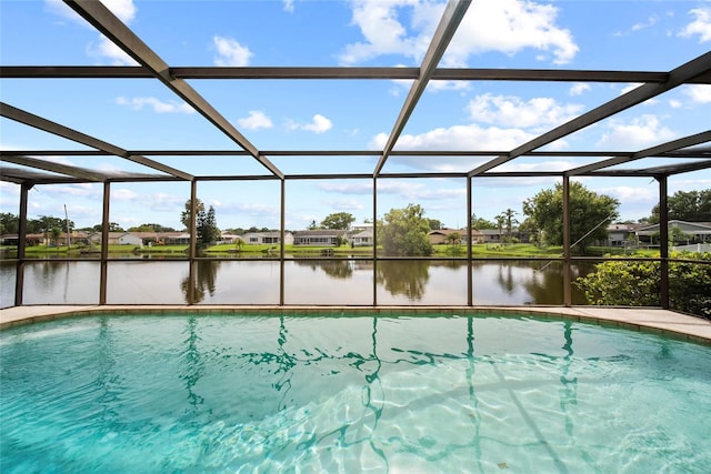 4371 Otter Way, New Port Richey, FL 34653 - swimming pool featuring a water view and glass enclosure