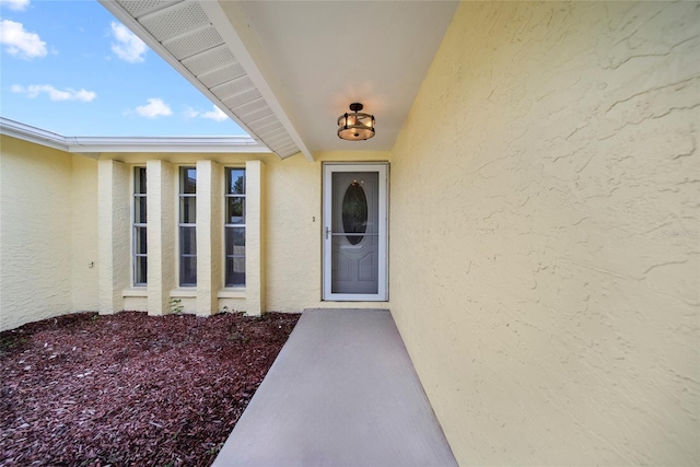 4371 Otter Way, New Port Richey, FL 34653 - view of exterior entry with stucco siding