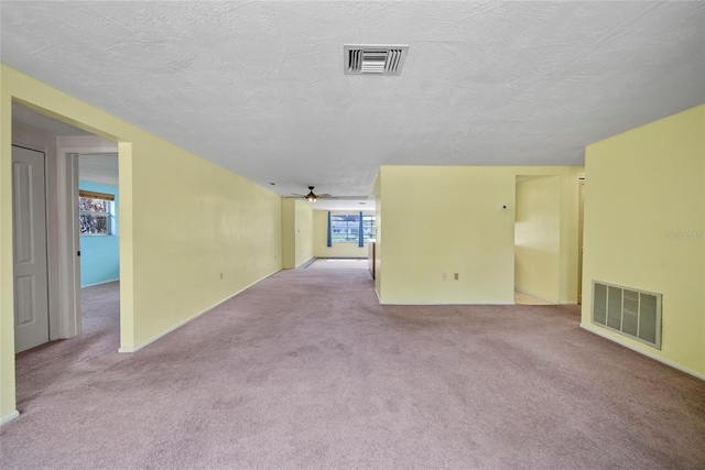 4371 Otter Way, New Port Richey, FL 34653 - carpeted empty room with a ceiling fan and a textured ceiling