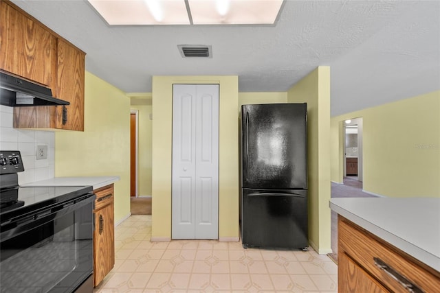 4371 Otter Way, New Port Richey, FL 34653 - kitchen featuring black appliances, exhaust hood, light countertops, brown cabinets, and tasteful backsplash