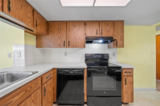 4371 Otter Way, New Port Richey, FL 34653 - kitchen featuring black appliances, under cabinet range hood, and brown cabinets
