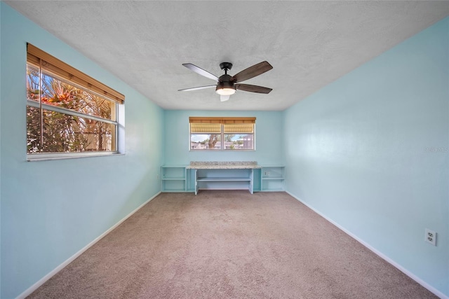 4371 Otter Way, New Port Richey, FL 34653 - carpeted spare room featuring a ceiling fan and a textured ceiling