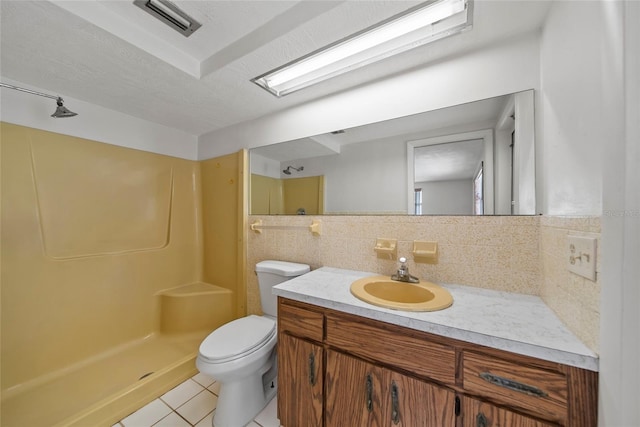 4371 Otter Way, New Port Richey, FL 34653 - full bath featuring tile patterned floors, vanity, a shower, and decorative backsplash