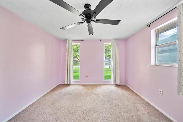 4371 Otter Way, New Port Richey, FL 34653 - carpeted empty room with ceiling fan and a textured ceiling