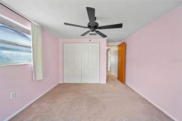 4371 Otter Way, New Port Richey, FL 34653 - unfurnished bedroom featuring a closet, carpet floors, and ceiling fan