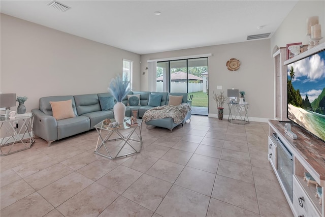 12591 Vander Way, New Port Richey, FL 34654 - living room featuring light tile patterned flooring