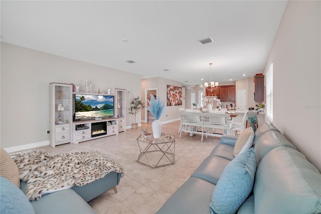 12591 Vander Way, New Port Richey, FL 34654 - living area with a chandelier, light tile patterned floors, recessed lighting, and a fireplace