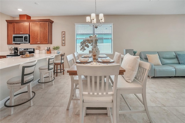 12591 Vander Way, New Port Richey, FL 34654 - dining area featuring a chandelier, light tile patterned floors, and recessed lighting