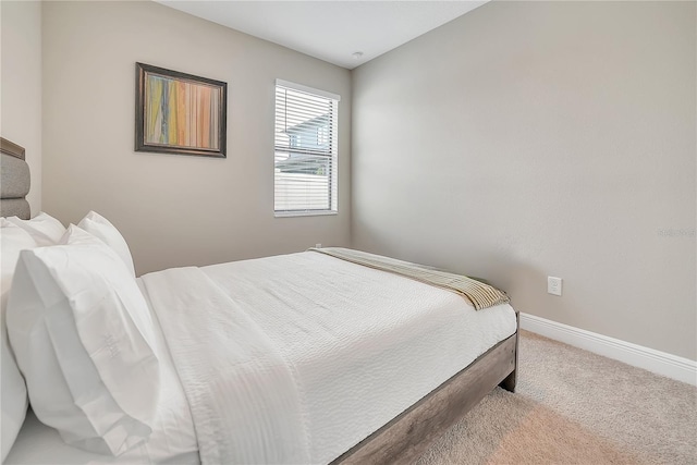 12591 Vander Way, New Port Richey, FL 34654 - bedroom with carpet floors and baseboards