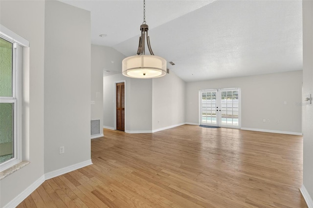 12331 Yellow Rose Cir, Riverview, FL 33569 - unfurnished room with lofted ceiling and light wood-style floors