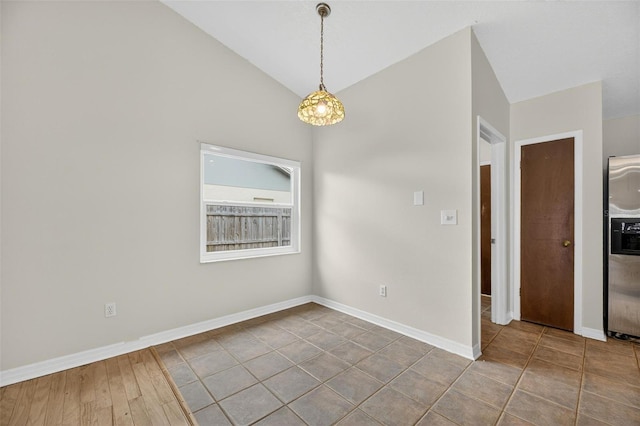 12331 Yellow Rose Cir, Riverview, FL 33569 - unfurnished dining area featuring vaulted ceiling and baseboards