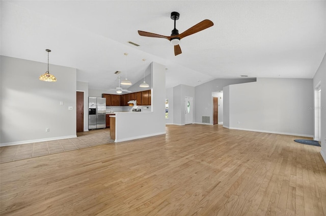 12331 Yellow Rose Cir, Riverview, FL 33569 - unfurnished living room with a ceiling fan, lofted ceiling, and light wood finished floors