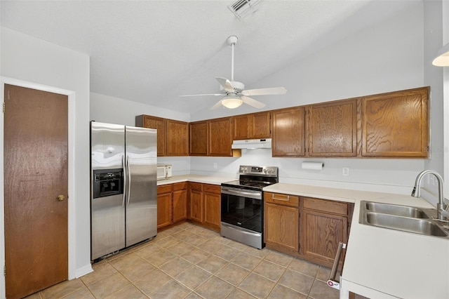12331 Yellow Rose Cir, Riverview, FL 33569 - kitchen featuring stainless steel appliances, under cabinet range hood, lofted ceiling, a ceiling fan, and brown cabinets