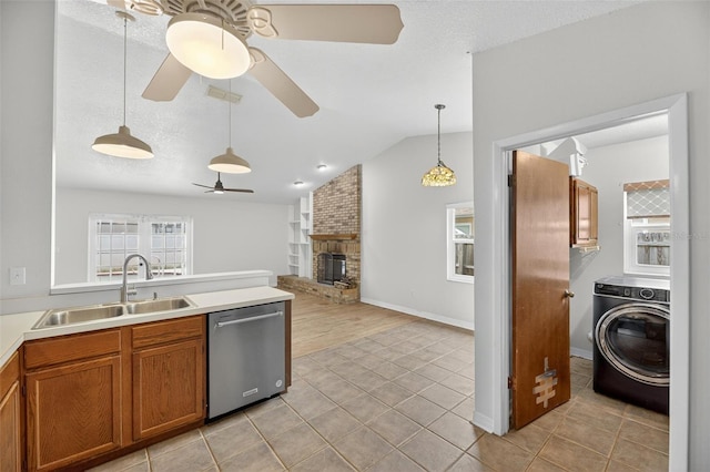 12331 Yellow Rose Cir, Riverview, FL 33569 - kitchen with dishwasher, washer / dryer, a ceiling fan, brown cabinets, and vaulted ceiling